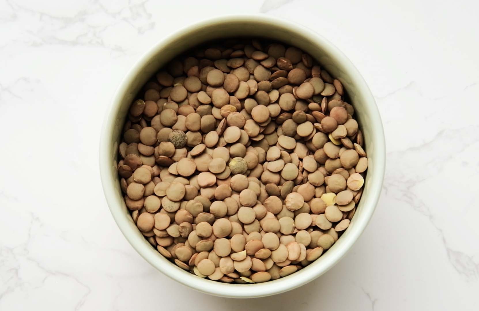 Dry brown lentils in a bowl