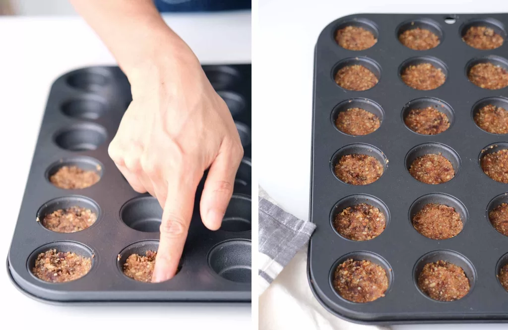 Forming the frozen mango tarts base using finger in a cupcake mold