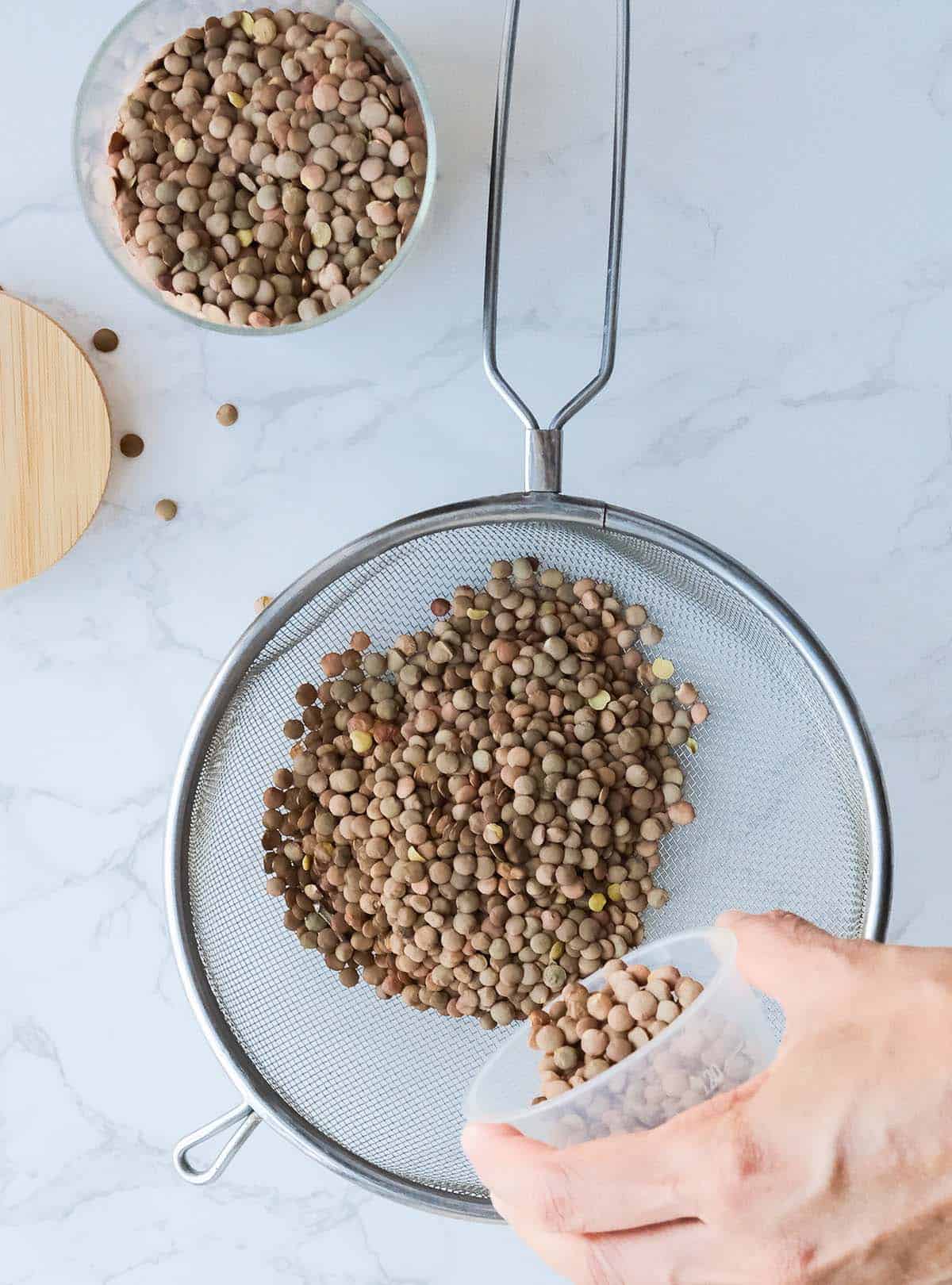 Pouring lentils into a strainer