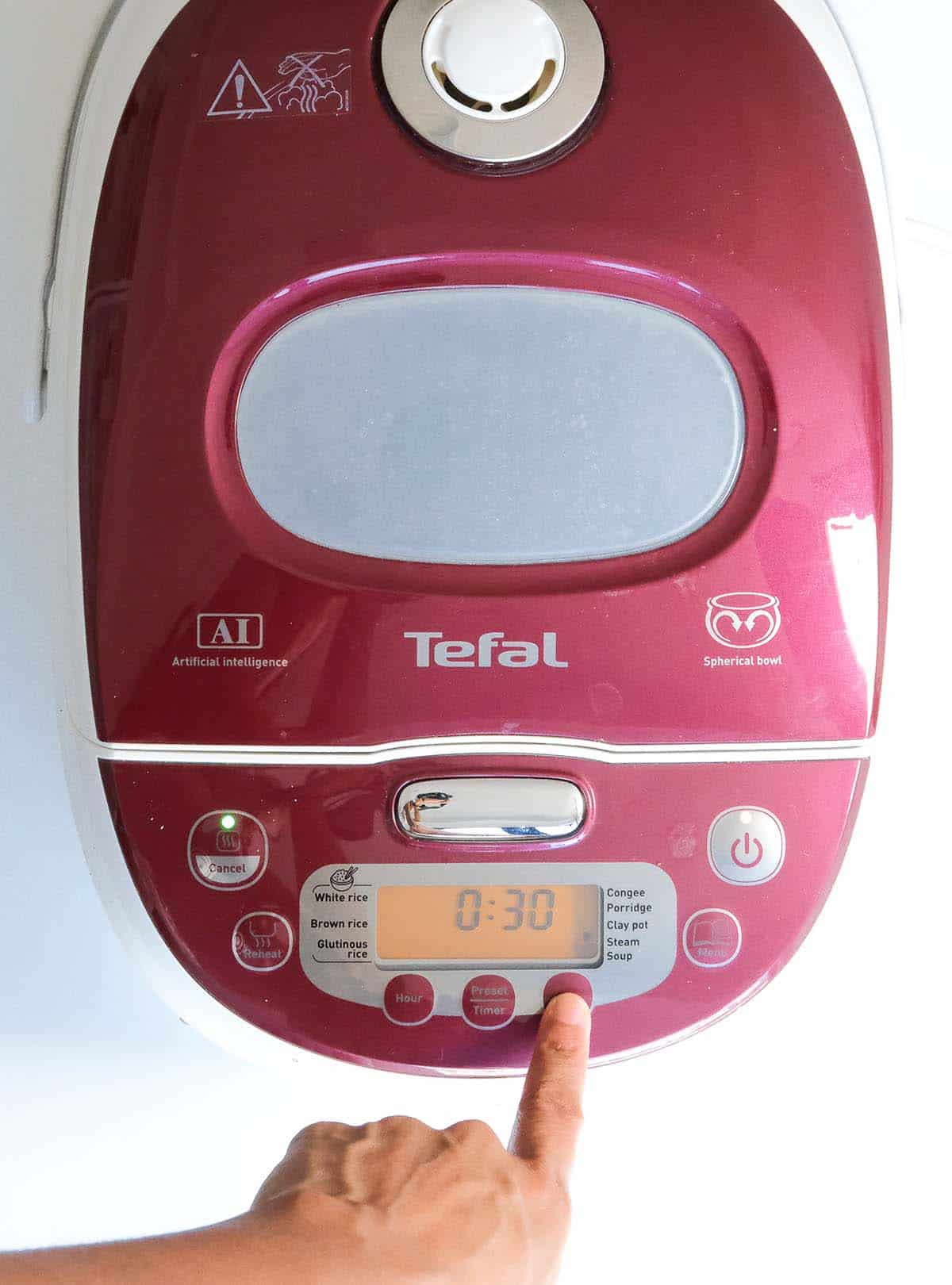 Setting the timer in a rice cooker to cook lentils