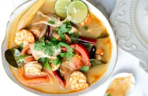 Tom Yum Nam Sai with prawn in a bowl