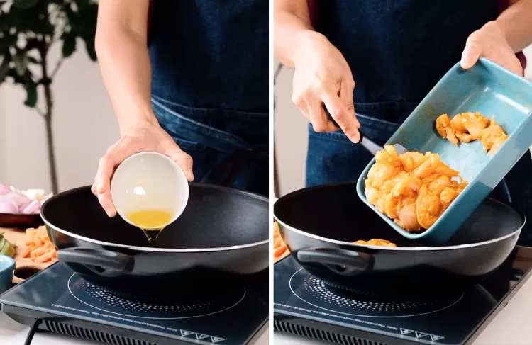 Step 2 on how to make turmeric and black pepper chicken: Pour oil to the pan and add marinated chicken fillet.