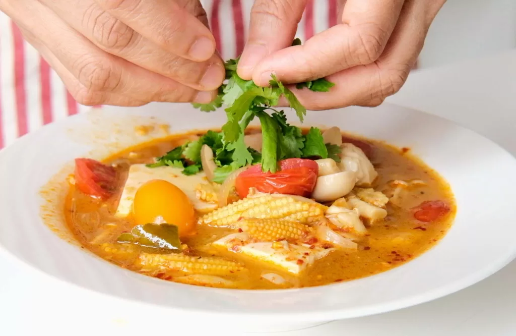 Step7 in making vegan tom yum soup_Garnish with coriander