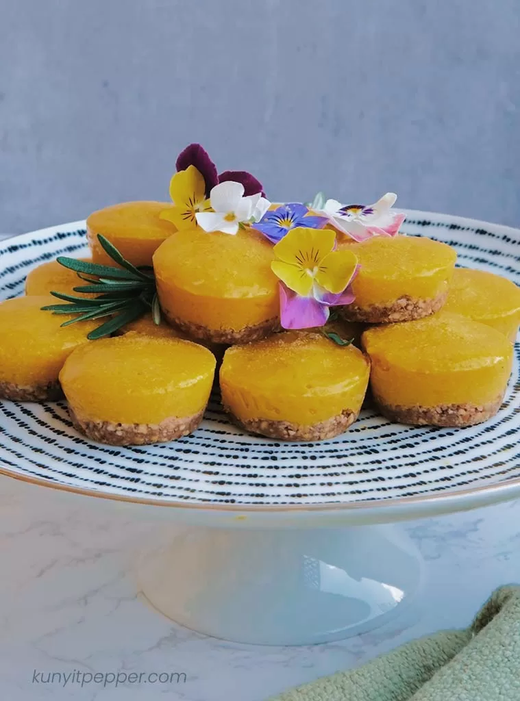 Frozen mango tart in a cake stand