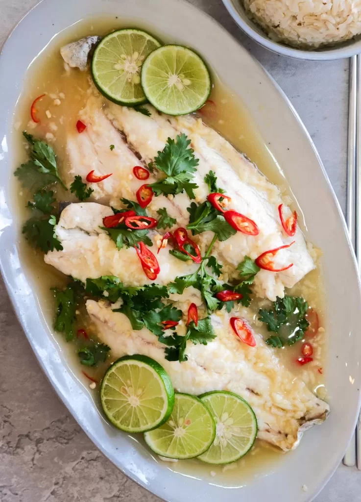 Oven-steamed fish  with garlic, ginger and lime