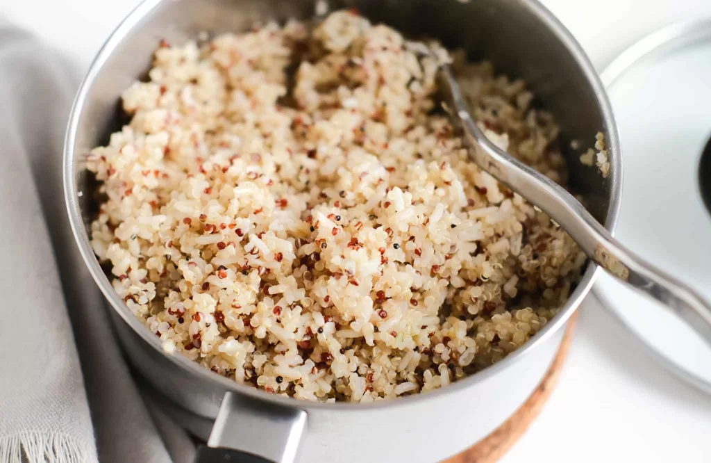 Cooked quinoa and brown rice in a pot