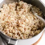 Cooked quinoa and brown rice in a pot