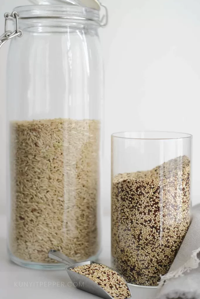 Quinoa and brown rice in jars