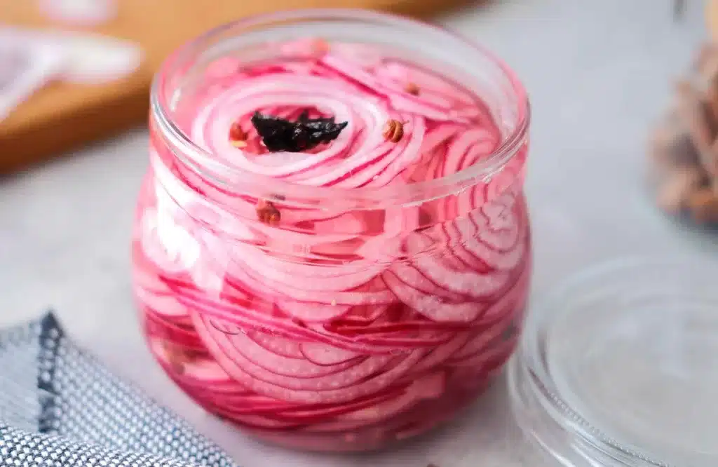 Asian pickled onion in a jar with lid open