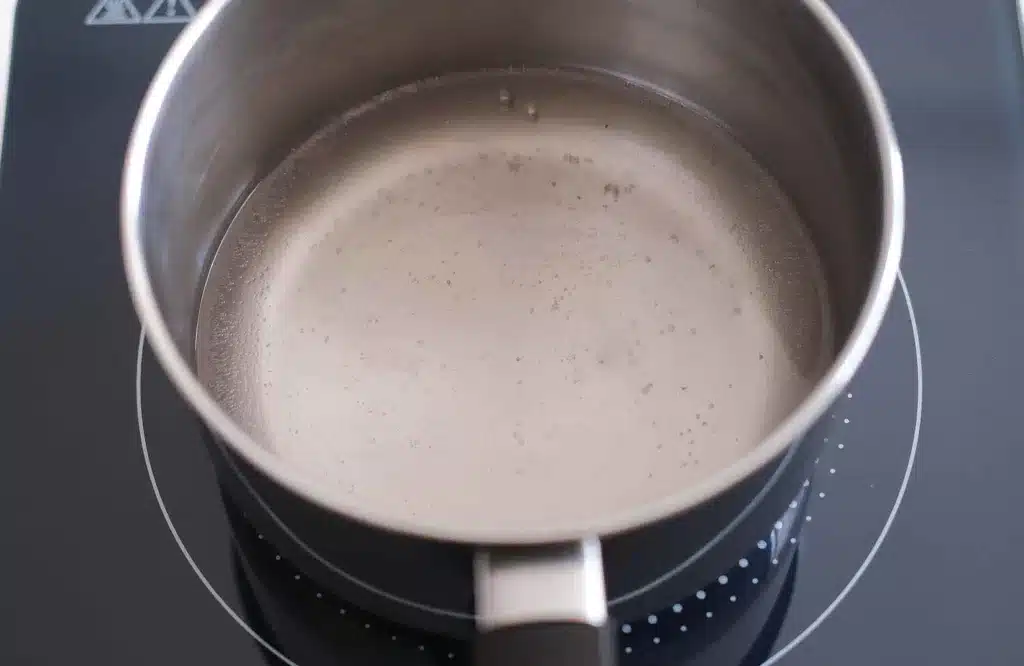 Cooking brine in a pot with water, vinegar, salt and sugar