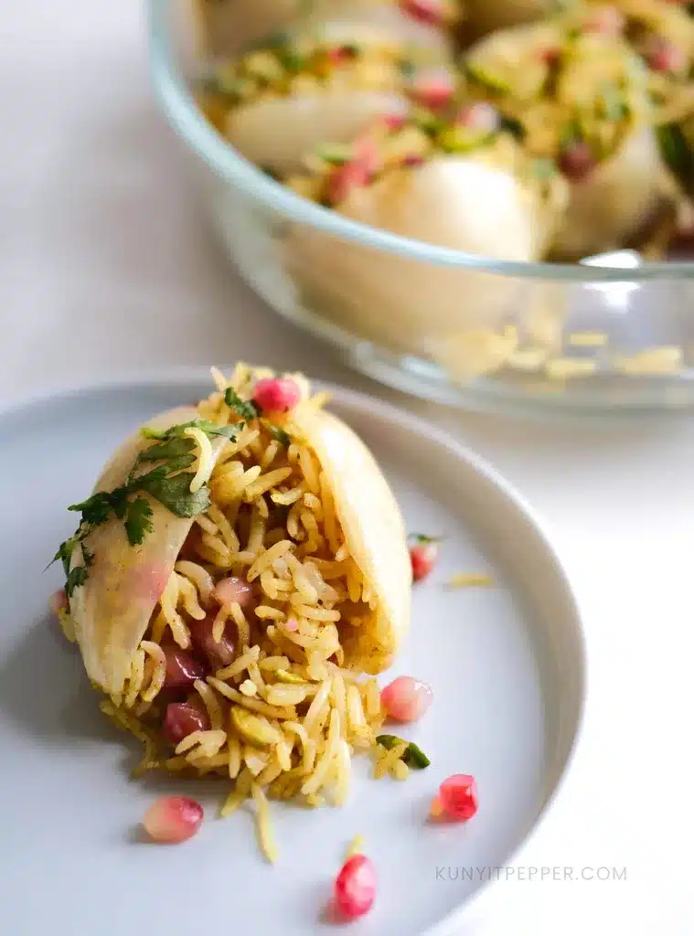 Stuffed Onion Pomegranate Rice in a plate