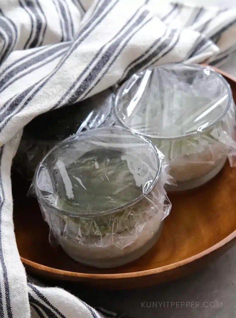 Fermented rice in a jars covered with plastic wrap