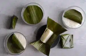 Traditional Indonesian Sweet Fermented Rice in banana leaves and jars