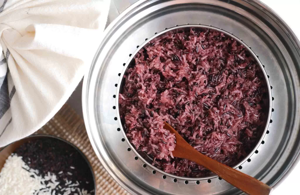 Top view of cooked Purple Sticky Rice in a steamer