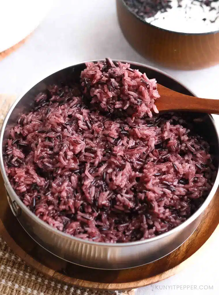 Thai Purple Sticky Rice with a wooden scoop