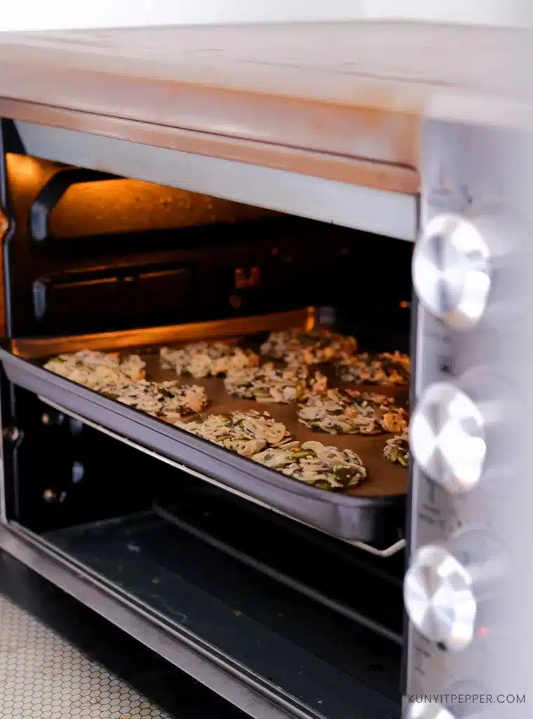 Baking Almond Florentine cookies in the middle rack of oven.