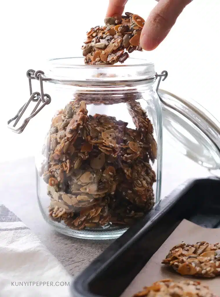 Arranging crispy Almond and Seed Cookies in a jar.jpg