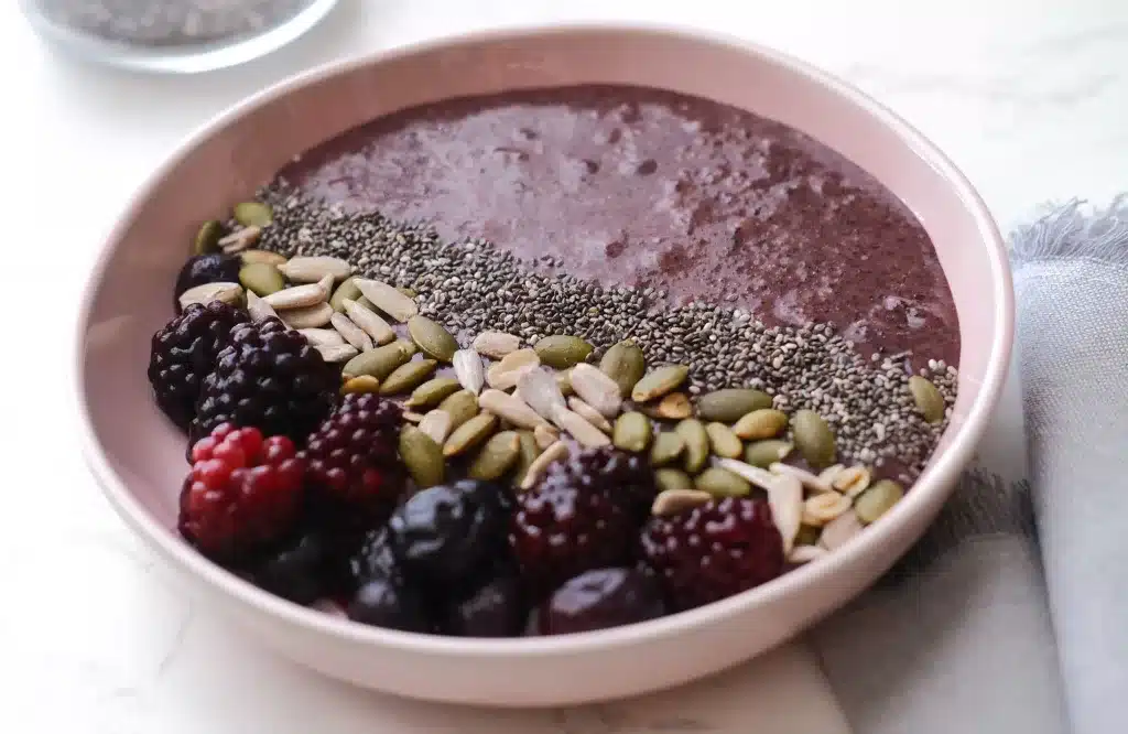 Healthy Black Sticky Rice bowl with seeds and berries