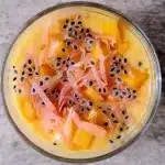 Top view of mango pomelo sago with basil seeds in a glass bowl