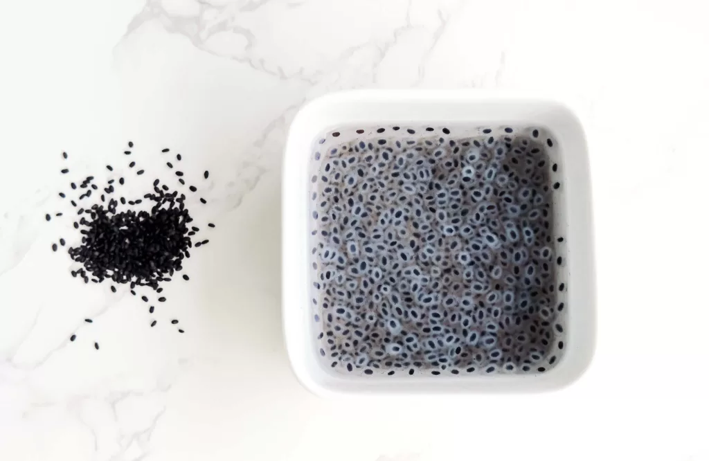 basil seeds before soaking and soaked basil seeds in a bowl