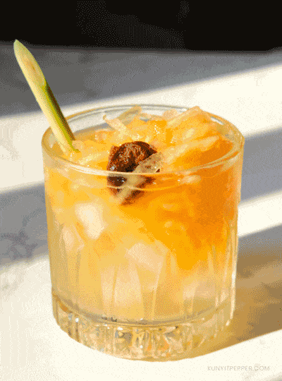 Filipino cantaloupe juice with dried plum in a glass and grated cantaloupe_looping