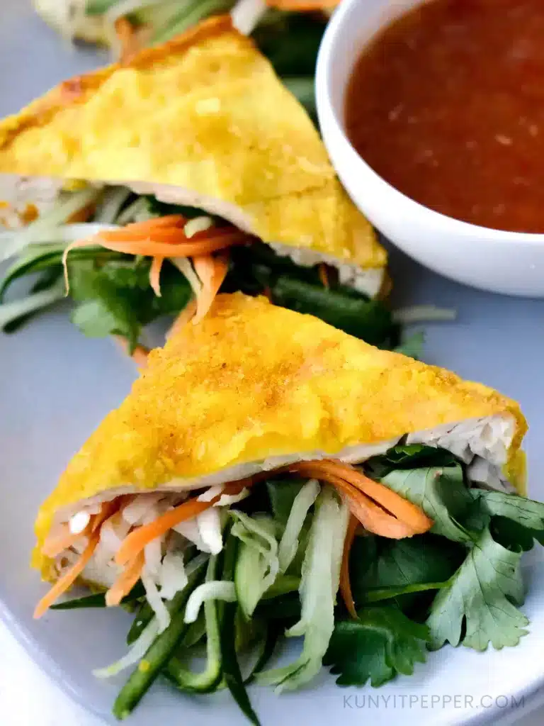 Asian Vegetables Stuffed Tofu next to Garlic Chili Sauce
