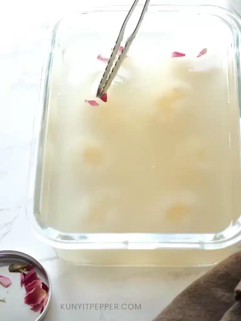Garnish coconut jelly lychee with rose bud