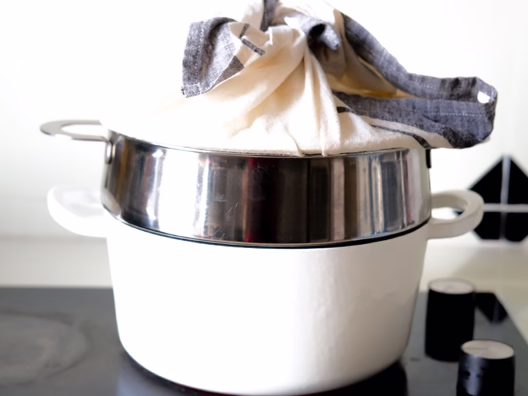 2 tier steamer with a lid covered with cloth 2 tier steamer with a lid covered with cloth