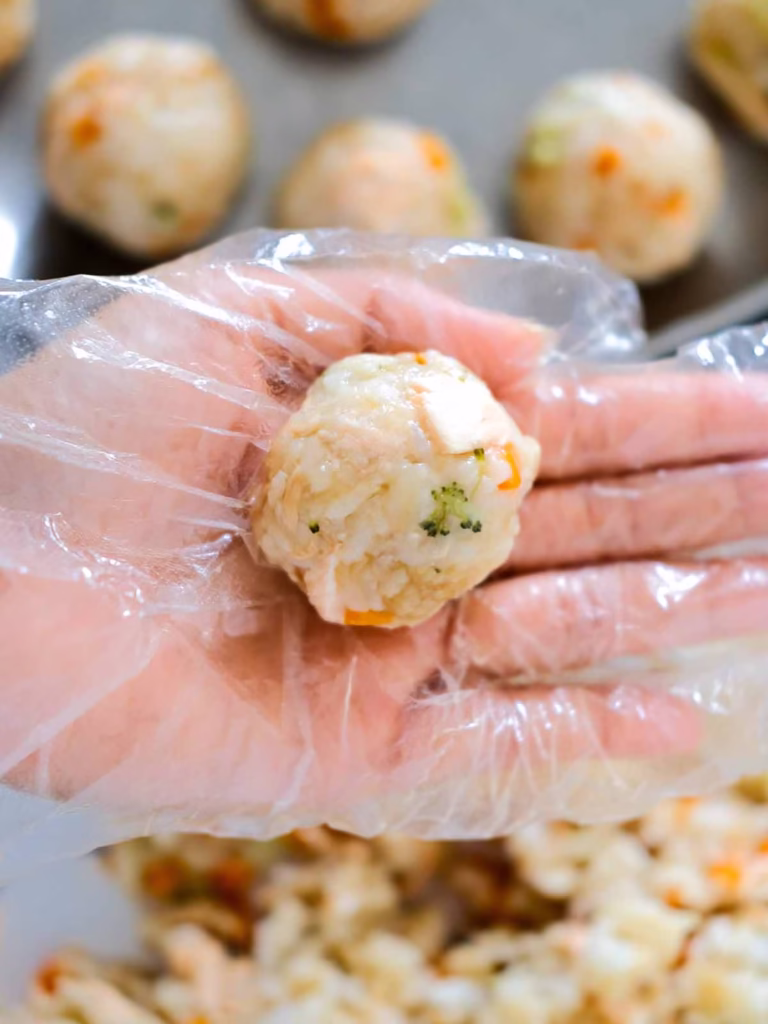 Shaping salmon rice balls with hand